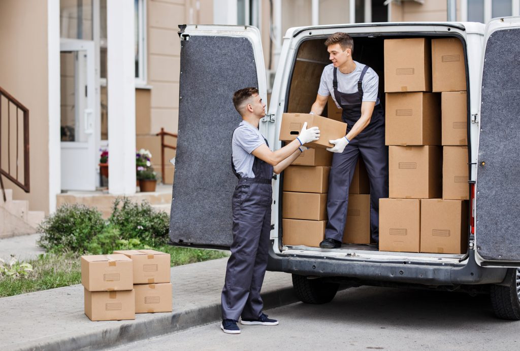 2 young handsome movers helping clients for Removals Ealing